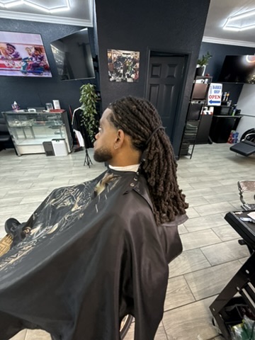 Long locs styled and finished